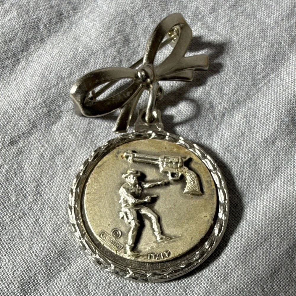 Vintage Italian Silver-Tone Medal Brooch Featuring Cowboy Motif